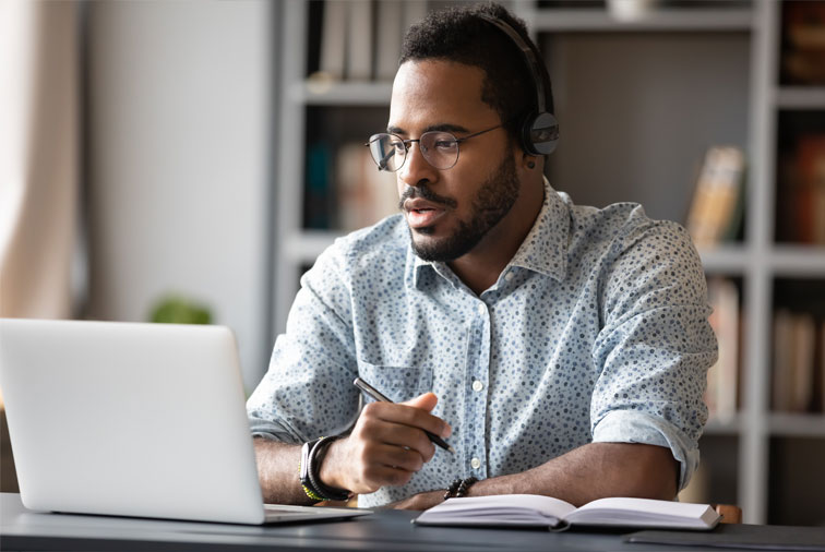 man-sitting-on-desk